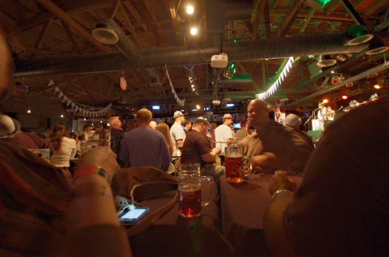 a large group of people at the table with drinks