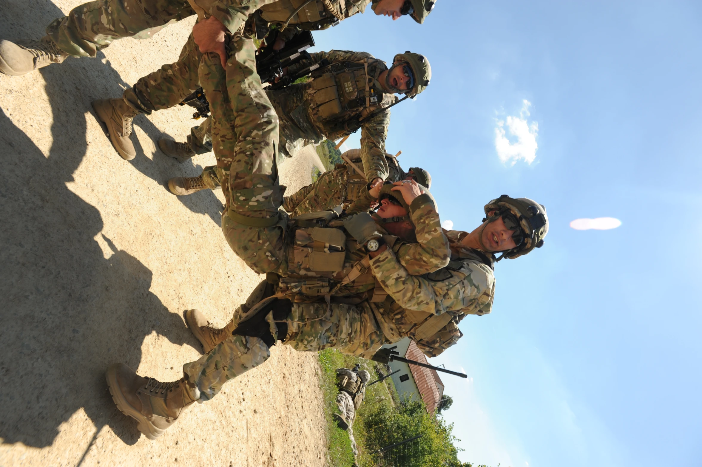 soldiers demonstrating their combat ss outdoors on a dirt area