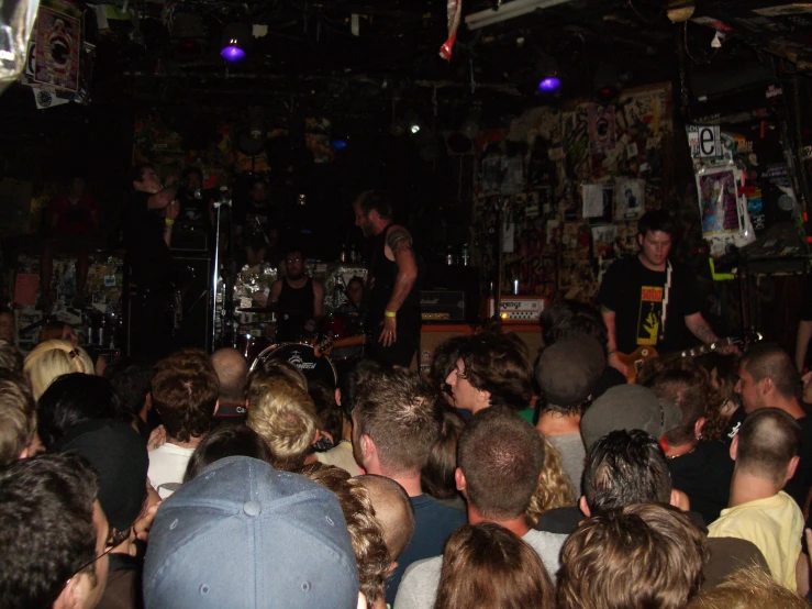 a group of people at a bar playing and singing