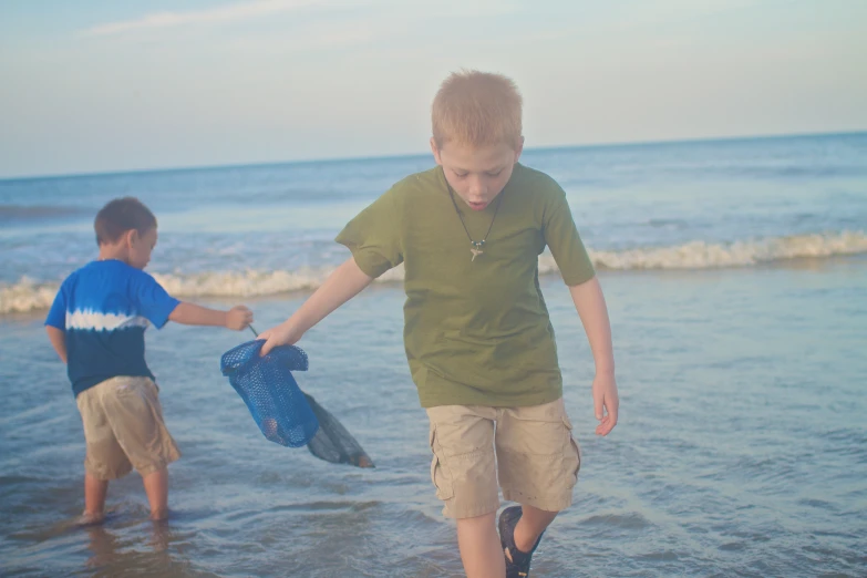 the two s are holding their catch in hand