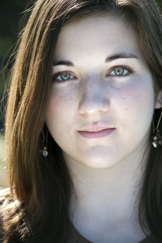 a close up of a person's face looking directly into the camera