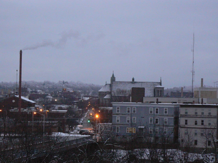 a city filled with buildings and trees covered in snow