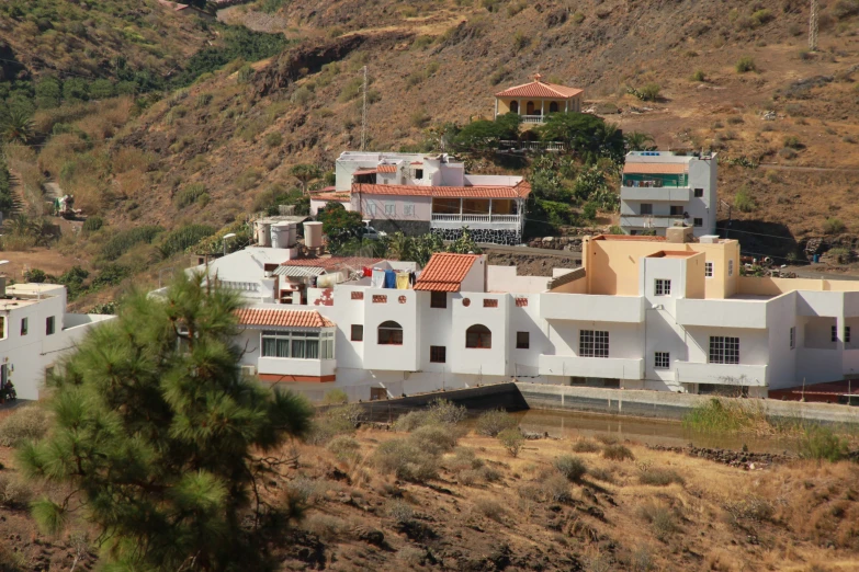 an aerial view of a home on a cliff