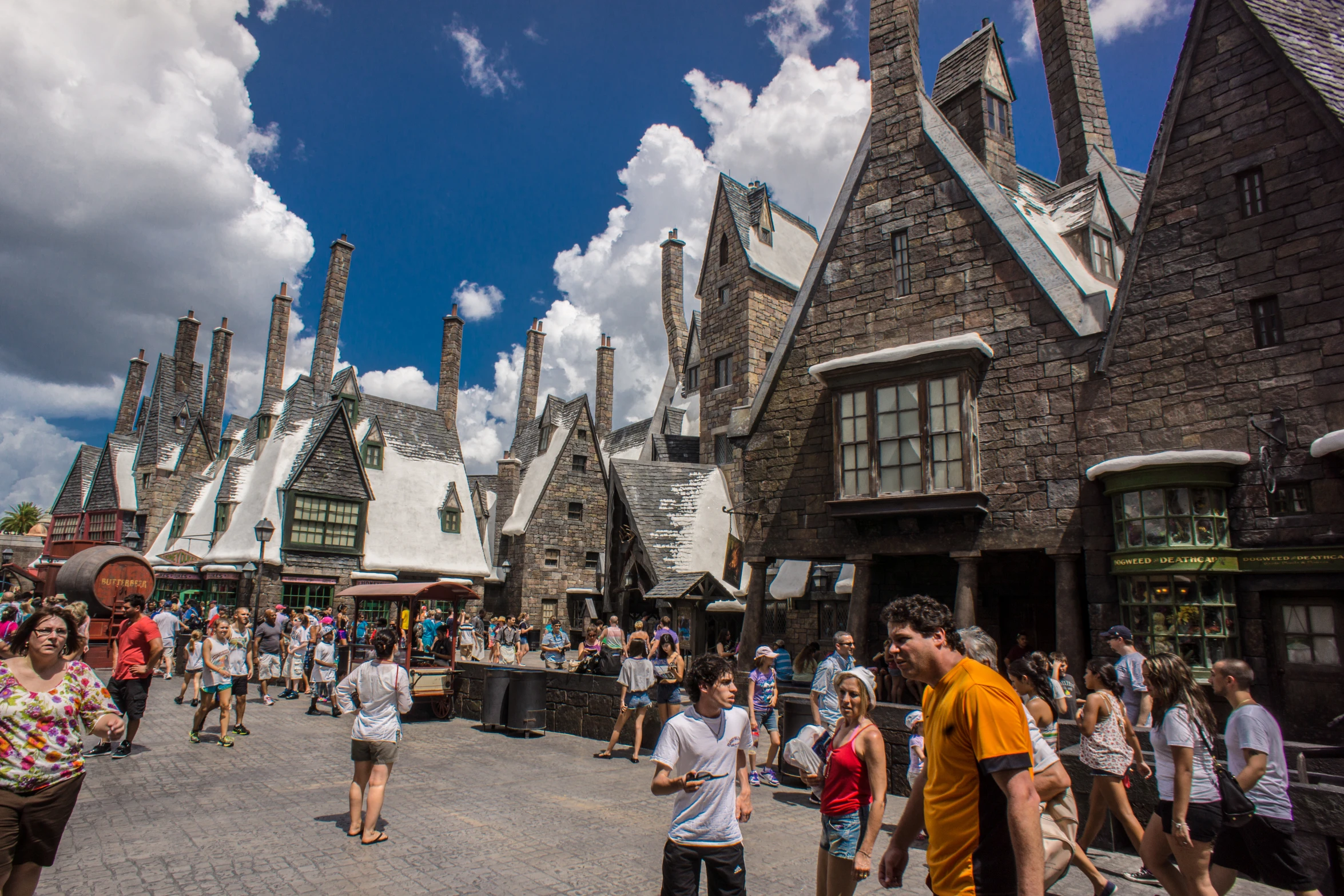 people walking around in front of a castle type building