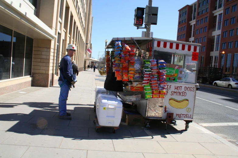 a food cart selling snacks on a street corner