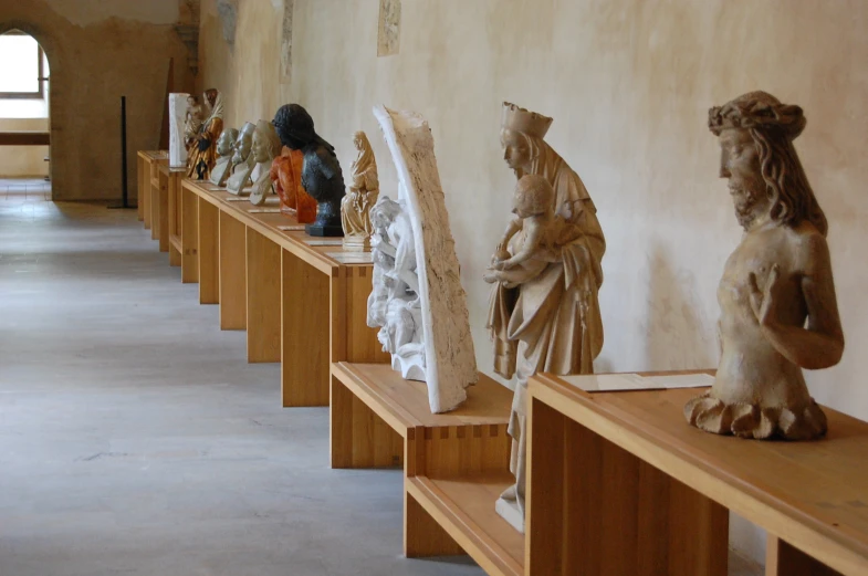 sculptures of animals are lined up on display