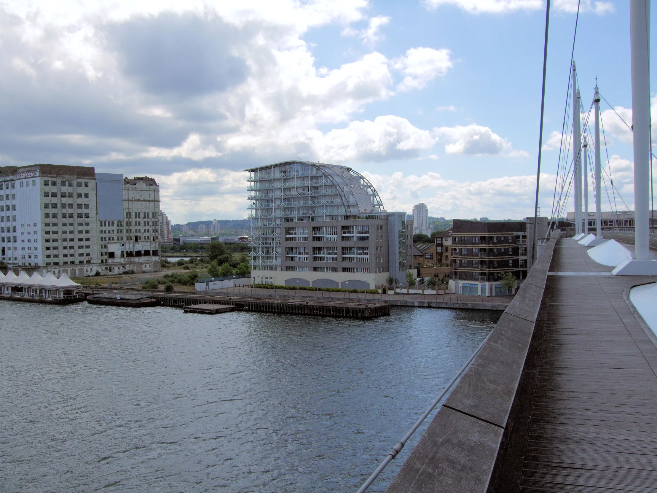 a couple of boats docked at the side of the water