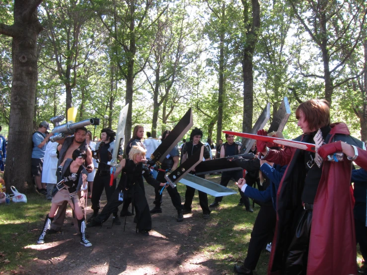 a bunch of people with costumes are in the park