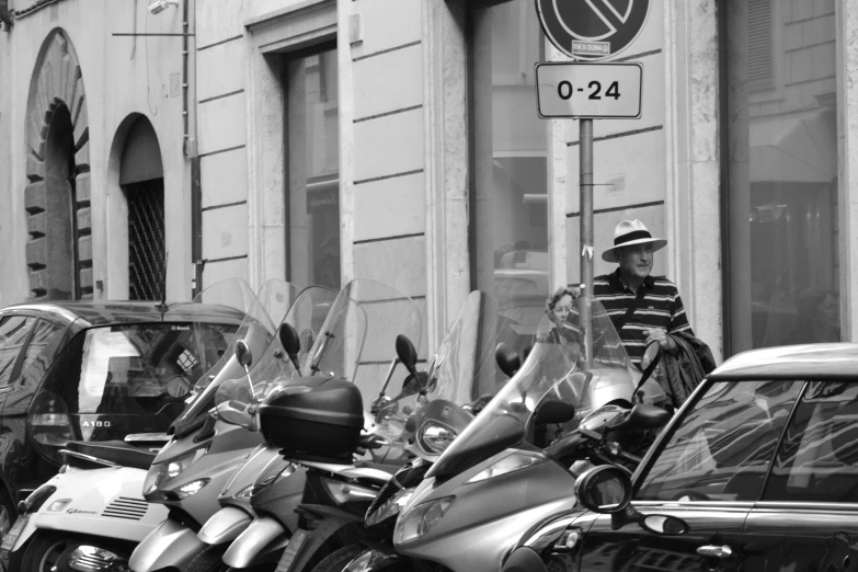 motorcycles parked in front of a building on a street