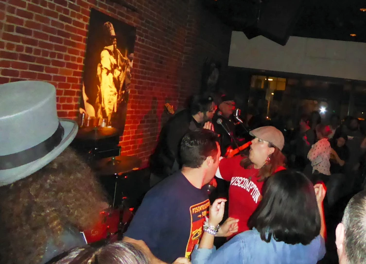 a crowded bar area with people in it