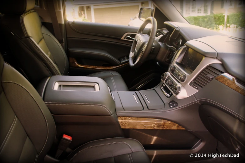 the inside of a vehicle that is dark and leather