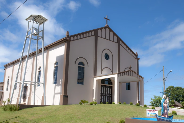 an old church with the steeple of it and water fountain