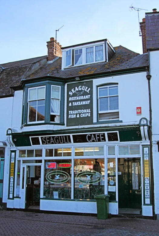 a building with windows and a store front