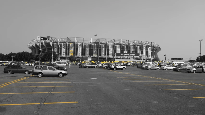 an empty parking lot next to an arena