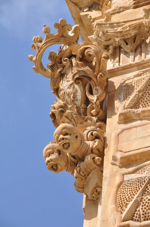 a close up s of the side of a building with a sky background