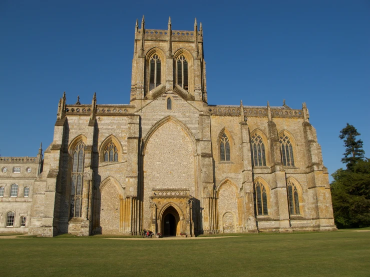 an old and stone cathedral is shown with trees