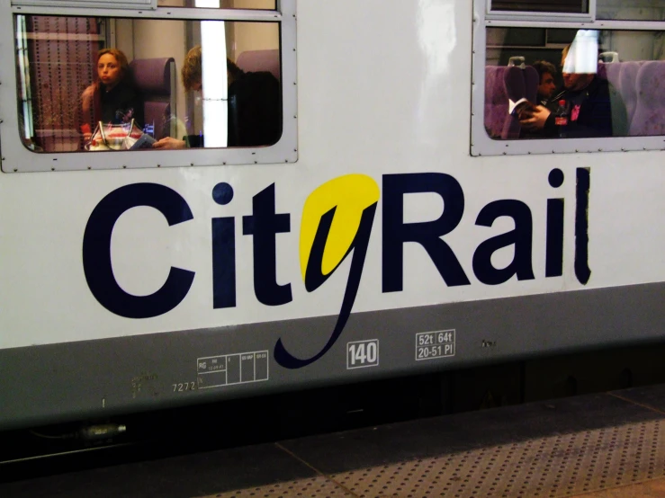 people in a window on the front of a train