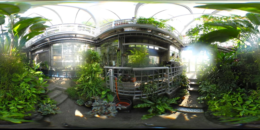 a view of a futuristic building with plants growing in it