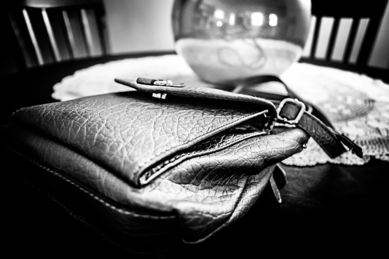 a black and white po of a purse on a table