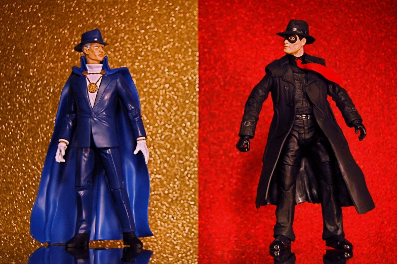two different figurines one with an outfit and the other wearing black and blue