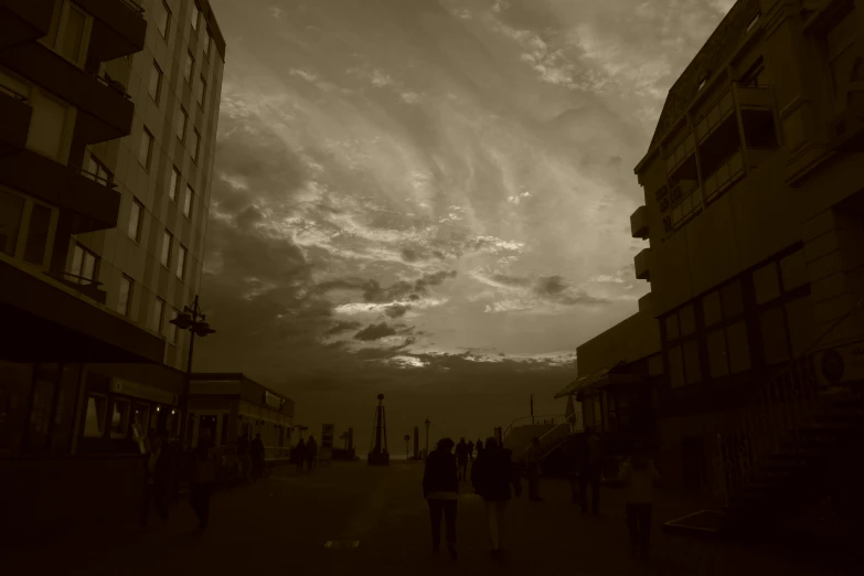 a group of people walking down a road