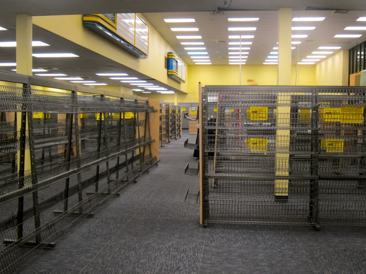 a large open cage filled with lots of cages