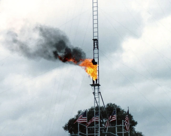 a small building with a fire going out of it