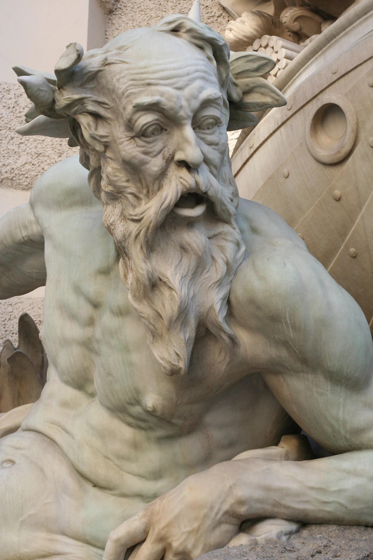 a statue in the form of a man with an evil expression