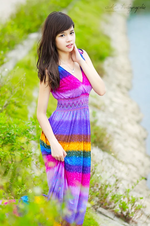 an asian lady in purple and blue