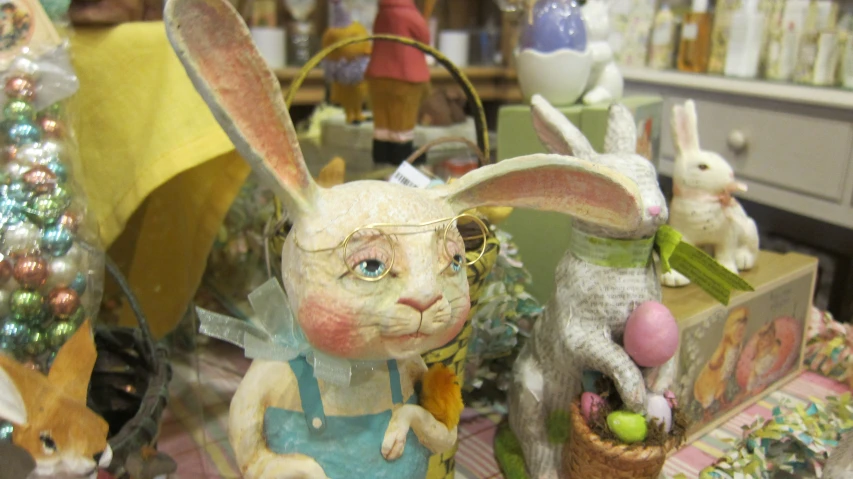 several easter decorations including rabbits, one with glasses and a hat