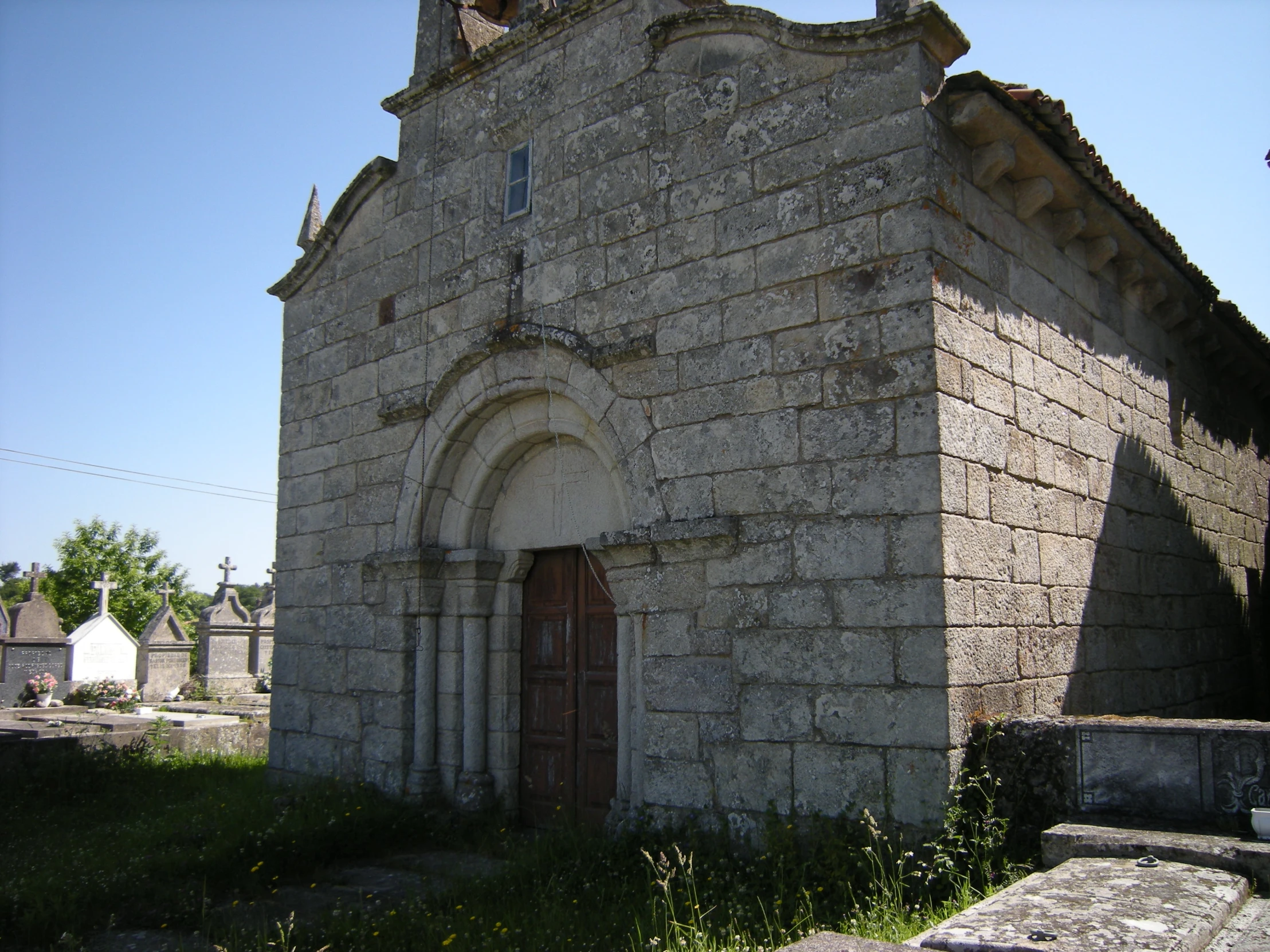 an old, stone building with a large door