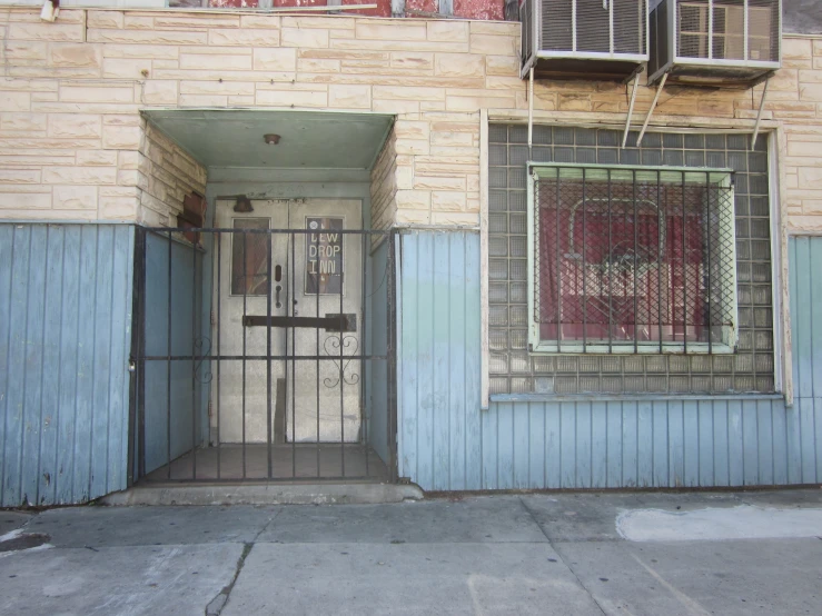 an abandoned building with a door and window