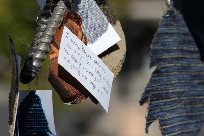 a number of items hanging from a wire