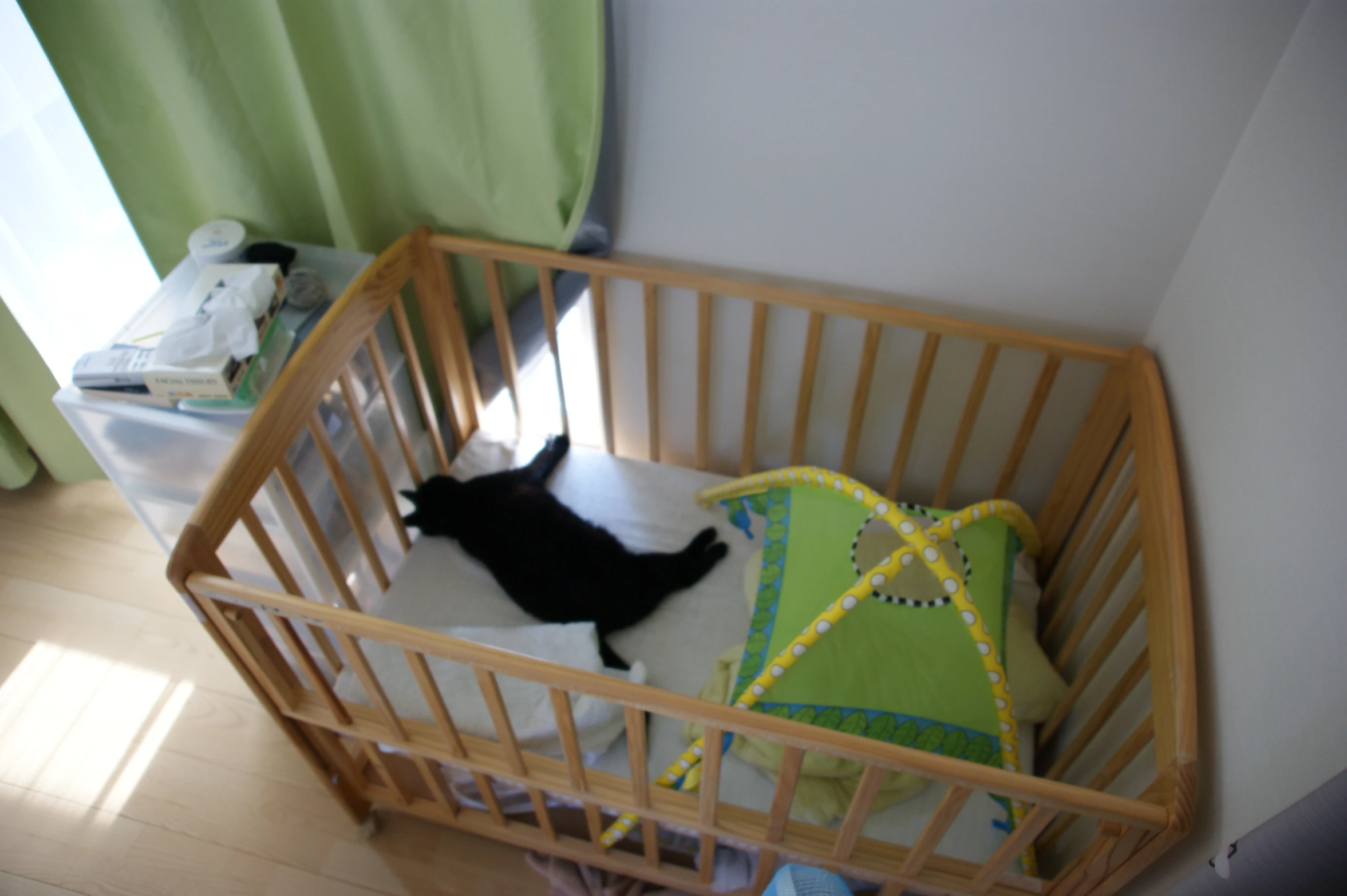 a baby crib with a baby's bed inside it