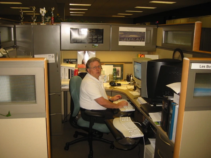 a man working on his computer in the office