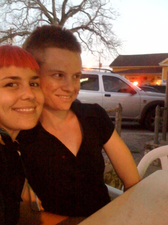 an image of a woman with red hair and man