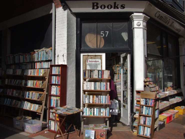 a sidewalk with a book store and lots of books on it