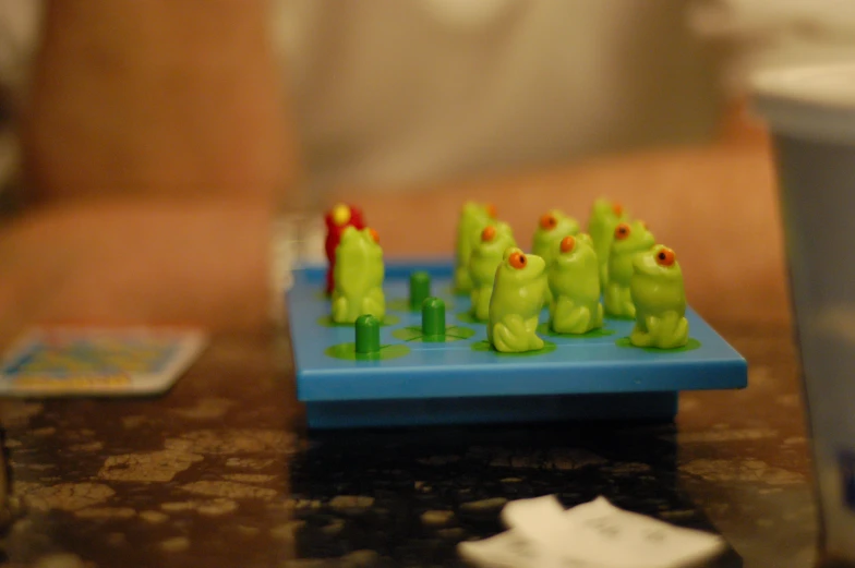 several plastic animals sitting on a blue tray