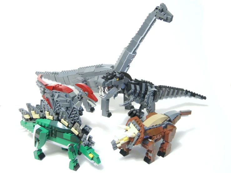 lego animals and two horses standing next to each other