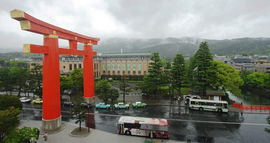 an overcast day in the city with a bus and building