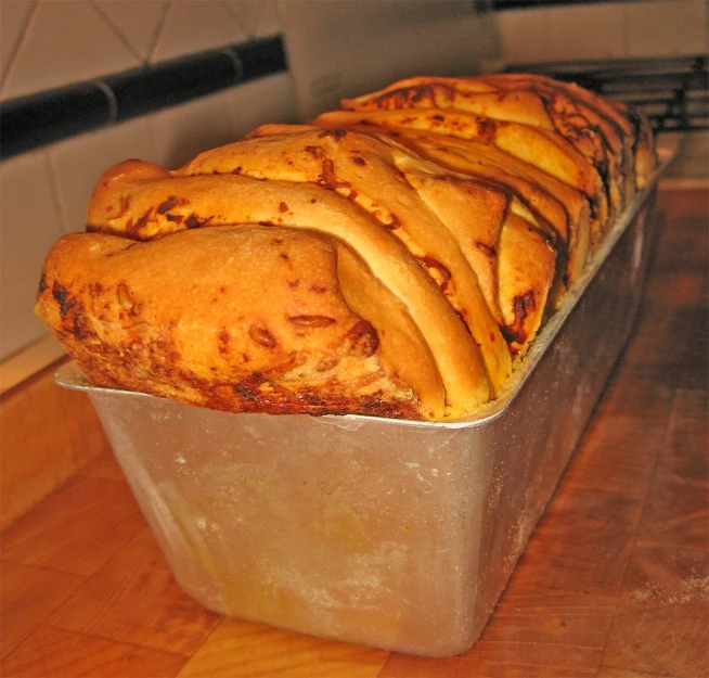 bread is sitting in a tin and has brown spots on it