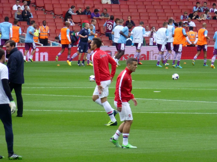 several players with a soccer ball on the field