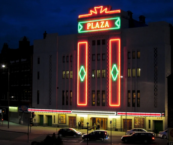 a large building with cars parked in front of it