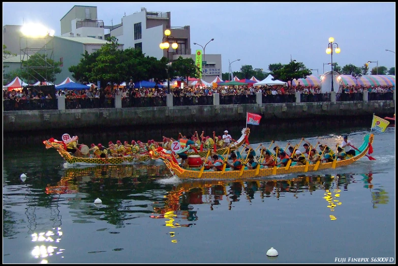 several people riding in a long boat in the water