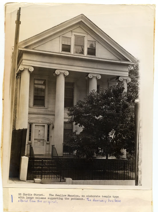 a house with columns and a number of steps