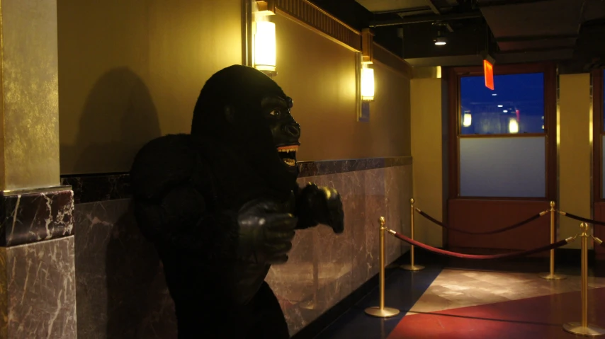 a gorilla statue in an indoor entrance way