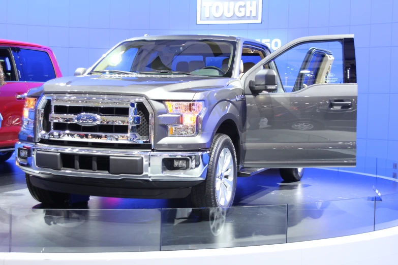 a truck sits on a show floor at the new york international auto show