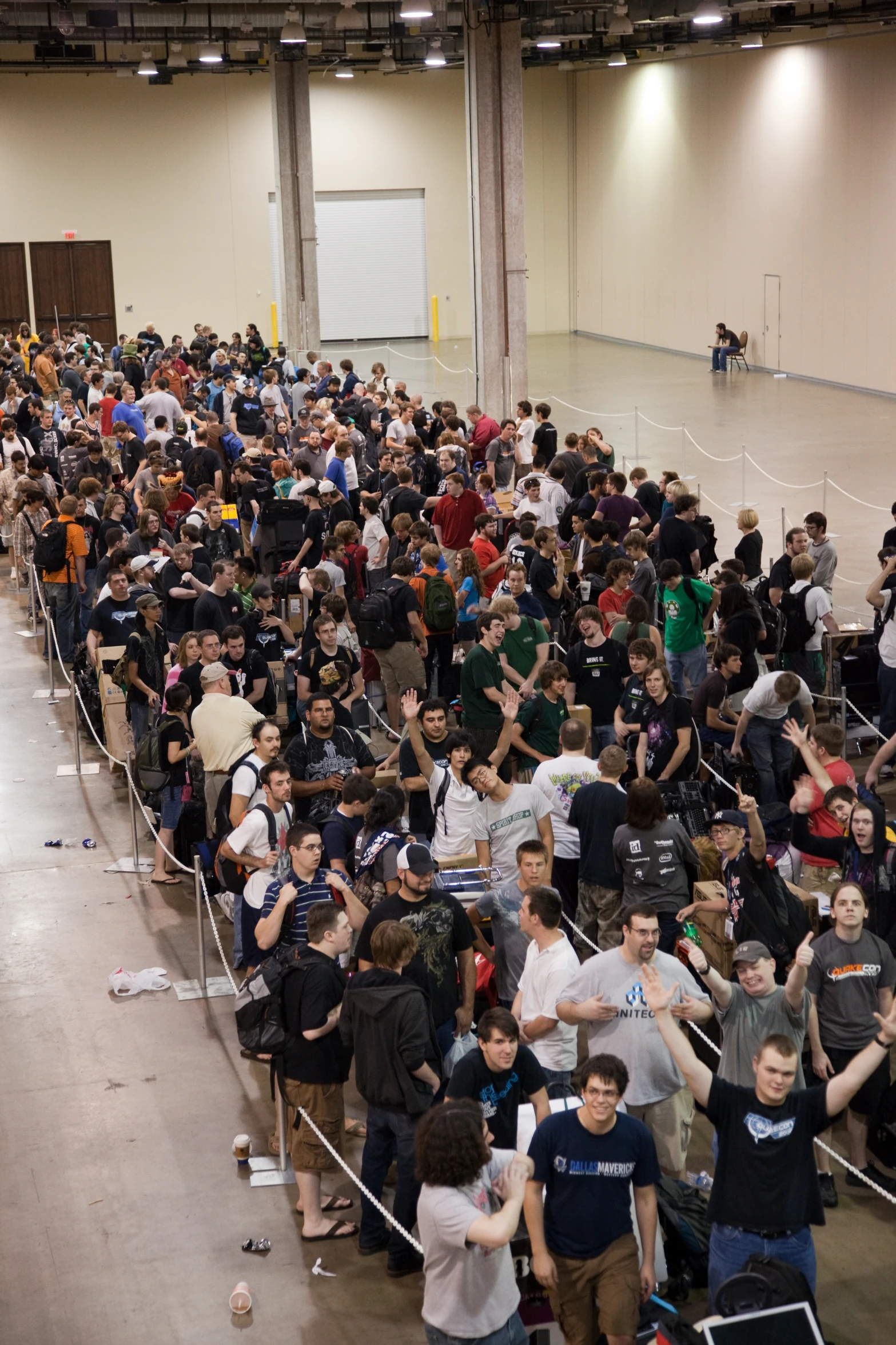 a group of people sitting in a long building