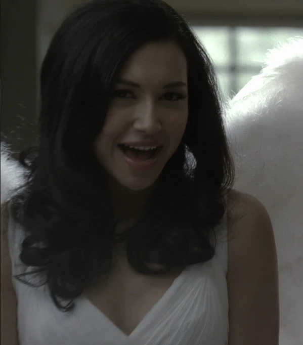 a woman that is wearing a dress and has a fake angel wings