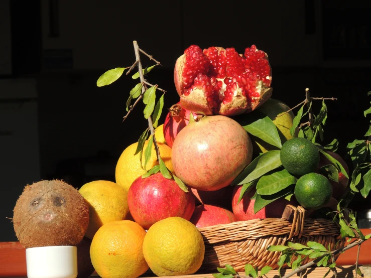 an assortment of fruit with a bowl of milk